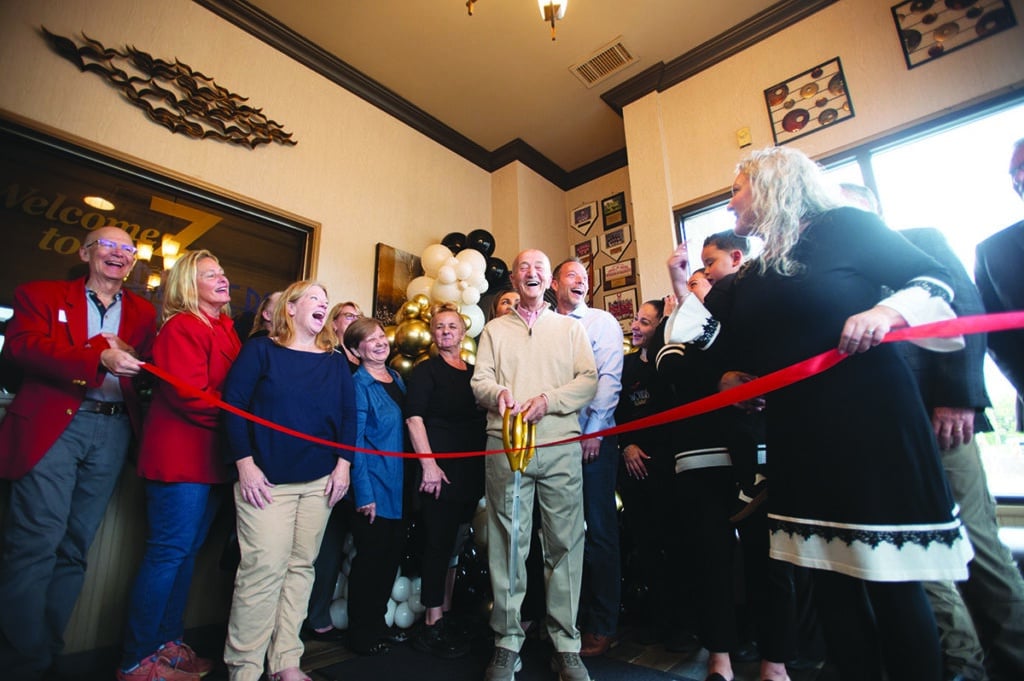 Independent photo by Tricia Carzoli.
Family, friends, and guests from the city are in a celebratory mood just before the ribbon was cut to celebrate the 45th anniversary of 3 Brothers Restaurant.